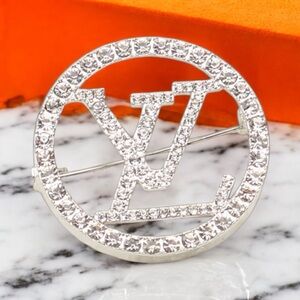 RHINESTONE AND SILVER FASHION BROOCH